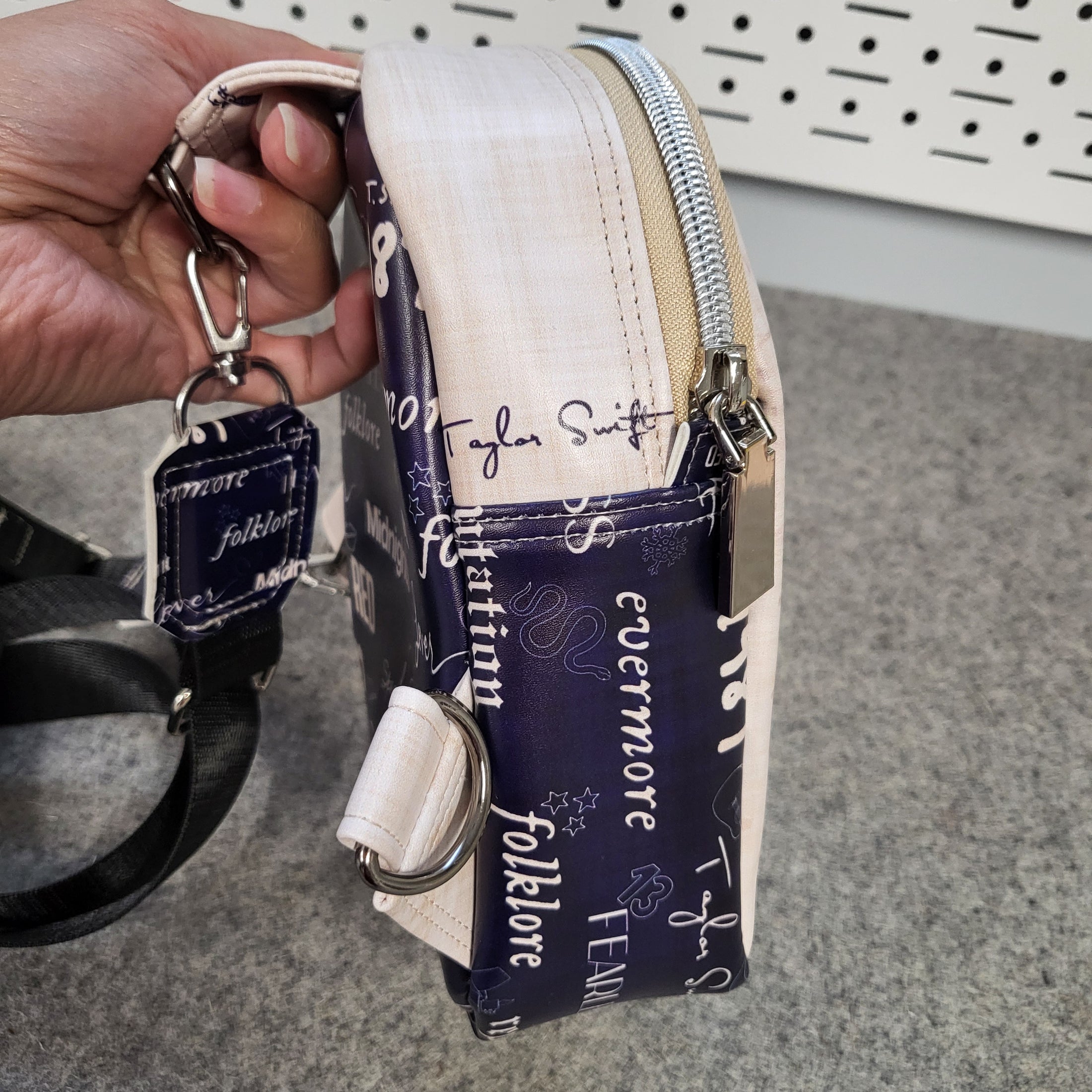 Side of the Swiftie Sling Bag showing an image of Taylor Swift's autograph.
