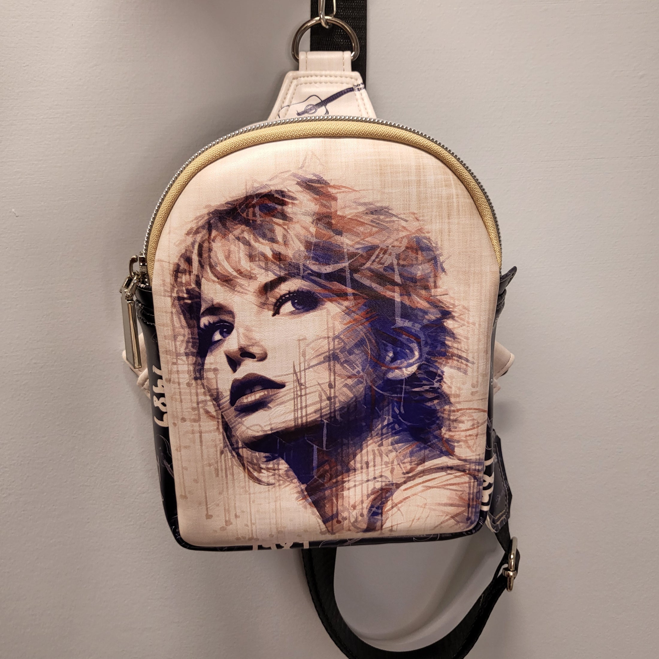 Swiftie sling bag with sketched image of Taylor Swift's face on the front. 