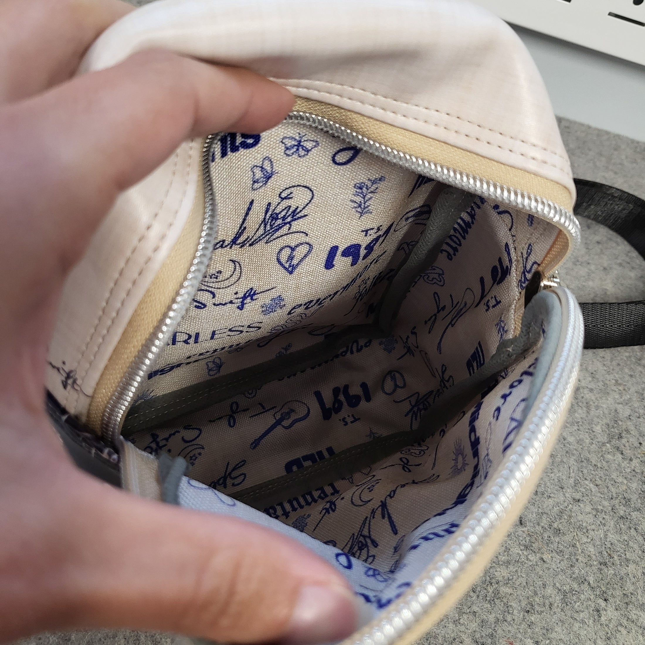 Main interior compartment of the Swiftie sling bag showing no raw edges and waterproof canvas lining.