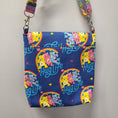Load image into Gallery viewer, Back of the hug life care bear purse. 
