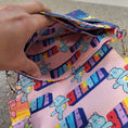 Load image into Gallery viewer, Interior slip pocket in the hug life care bear bag. 
