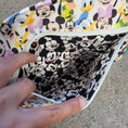 Load image into Gallery viewer, Lining of the zipper pocket on the Fab Five Dayna Fanny Pack.
