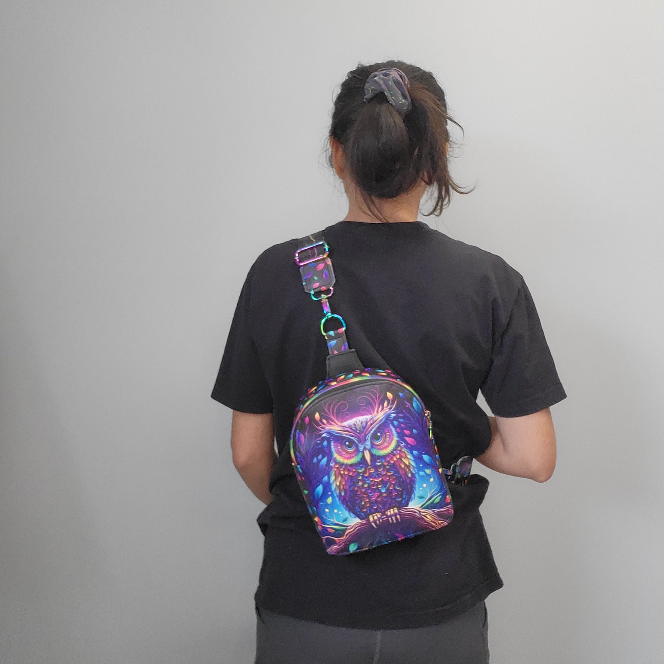 Person wearing the Majestic Owl sling bag. 