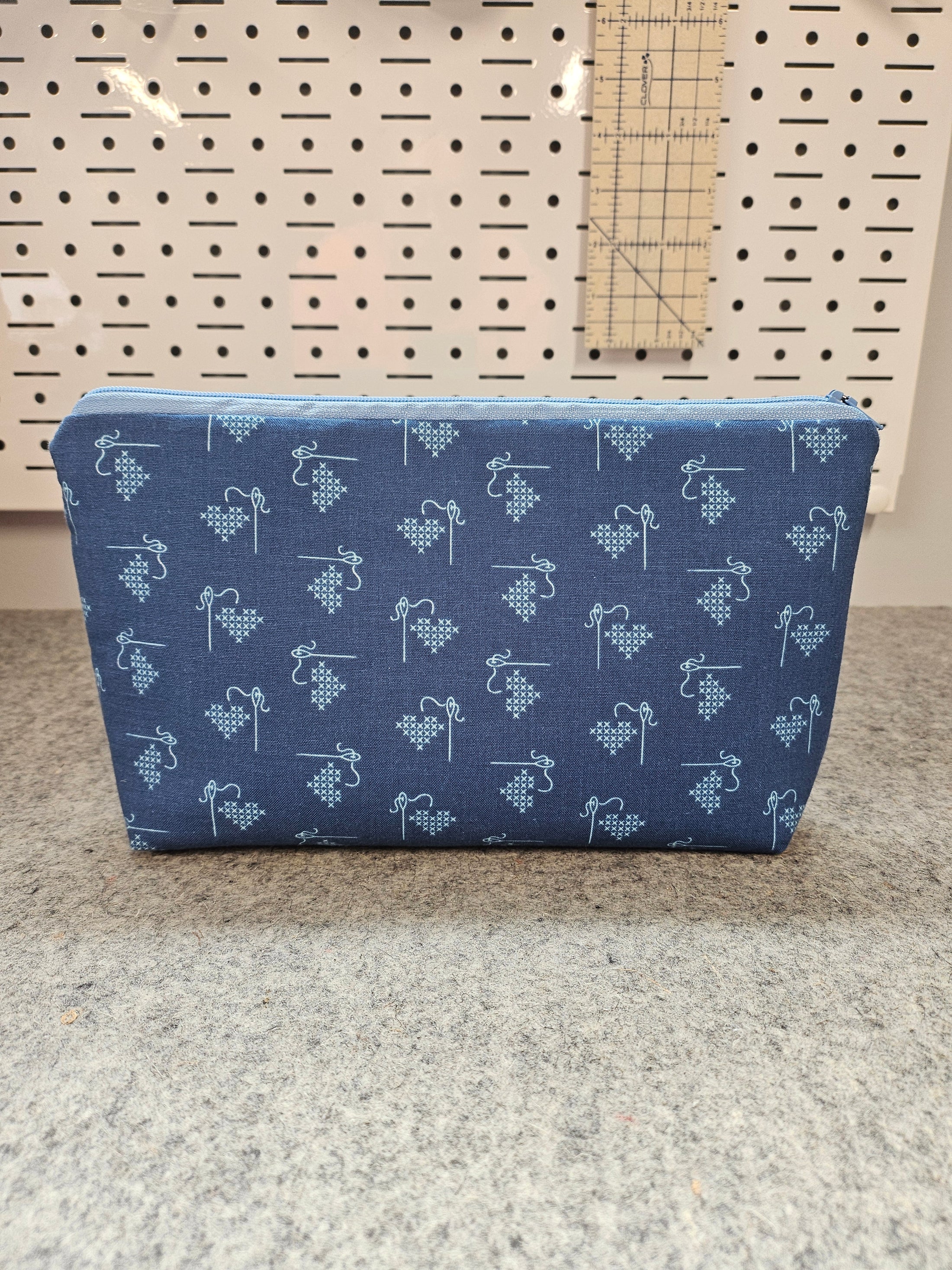 Blue heart cross stitch project bag zipper pouch.