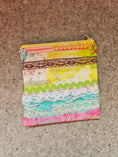 Load image into Gallery viewer, Watercolor lace zipper pouch with yellow zipper.
