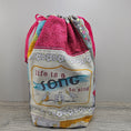 Load image into Gallery viewer, Life is a song to sing quilted drawstring bag with flat bottom.
