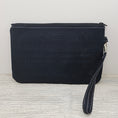 Load image into Gallery viewer, Black back of the skull zippy clutch.
