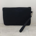 Load image into Gallery viewer, Black back of the crows zippy clutch.
