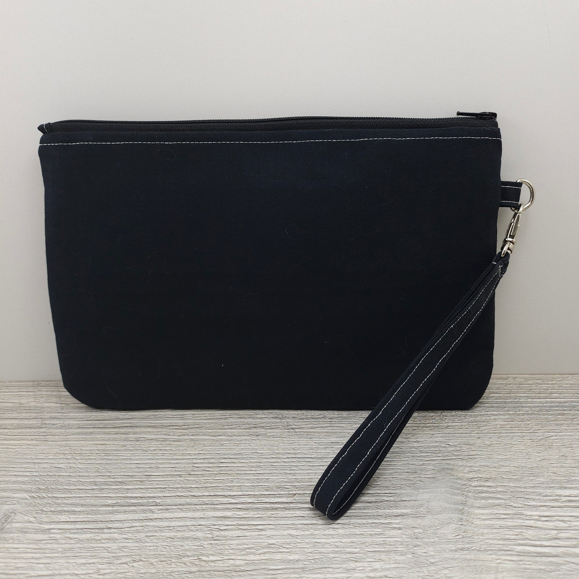 Black back of the crows zippy clutch.