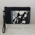 Load image into Gallery viewer, Crows zippy clutch with detachable wristlet strap and credit card organizer. 
