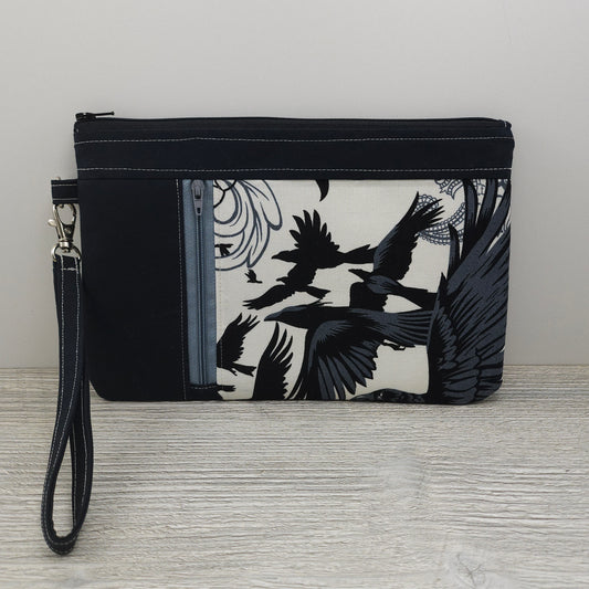 Crows zippy clutch with detachable wristlet strap and credit card organizer. 
