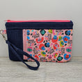 Load image into Gallery viewer, We rise by lifting others zippy clutch with detachable strap.
