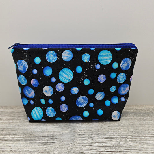 Outer space themed pencil pouch with zipper. 
