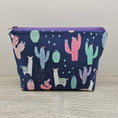 Load image into Gallery viewer, Llama cactus zipper storage pouch with flat bottom and zipper closure. 
