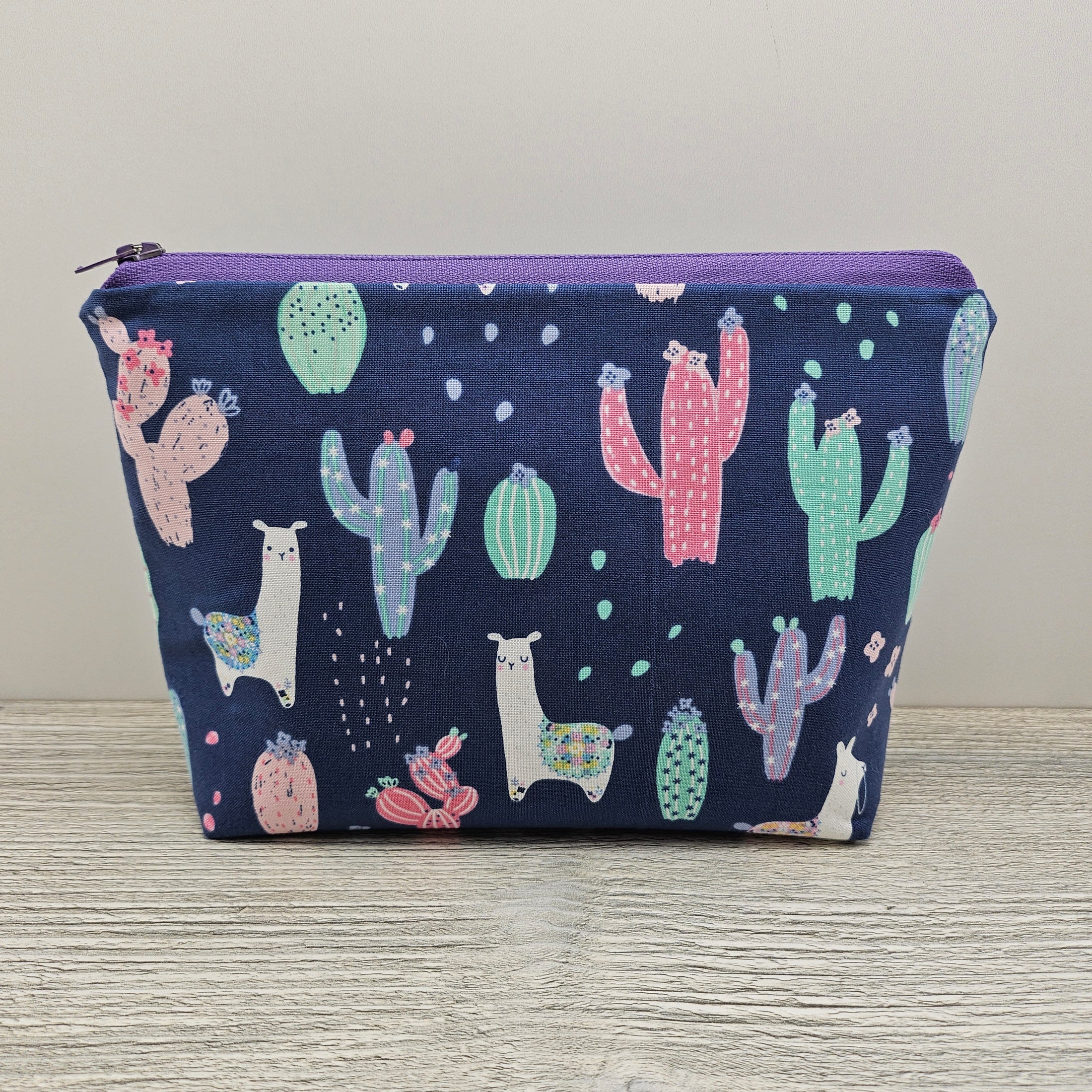 Llama cactus zipper storage pouch with flat bottom and zipper closure. 