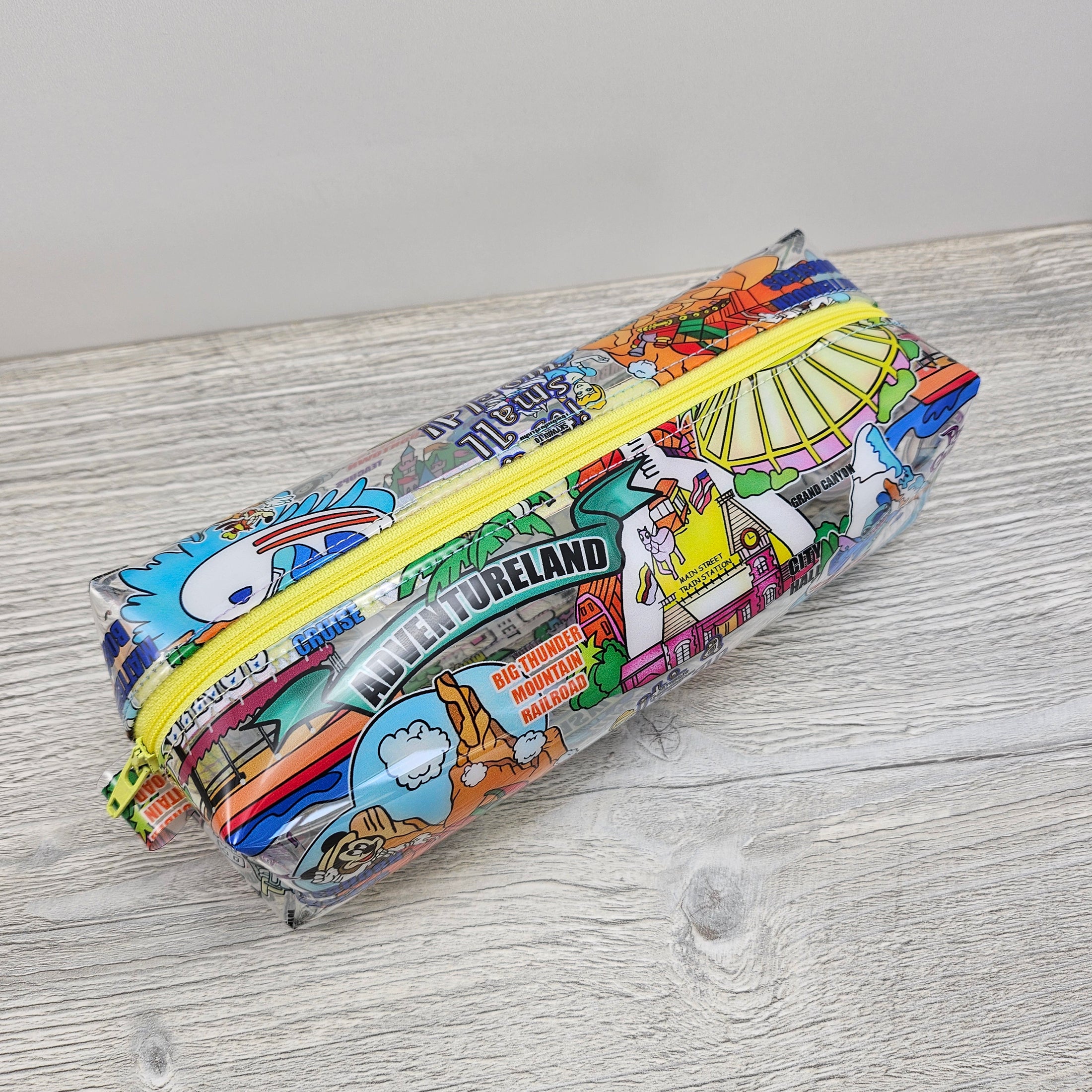 Clear vinyl pencil pouch with disney parks.