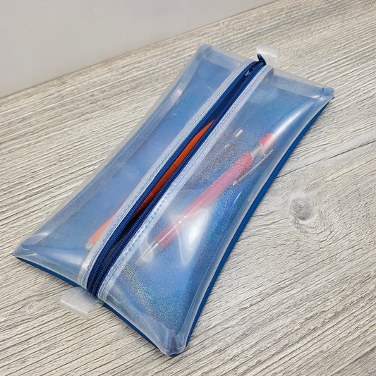 Glitter and blue vinyl pencil pouch with zipper. 