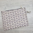 Load image into Gallery viewer, Floral skull cork bag organizer with swivel hook latch.
