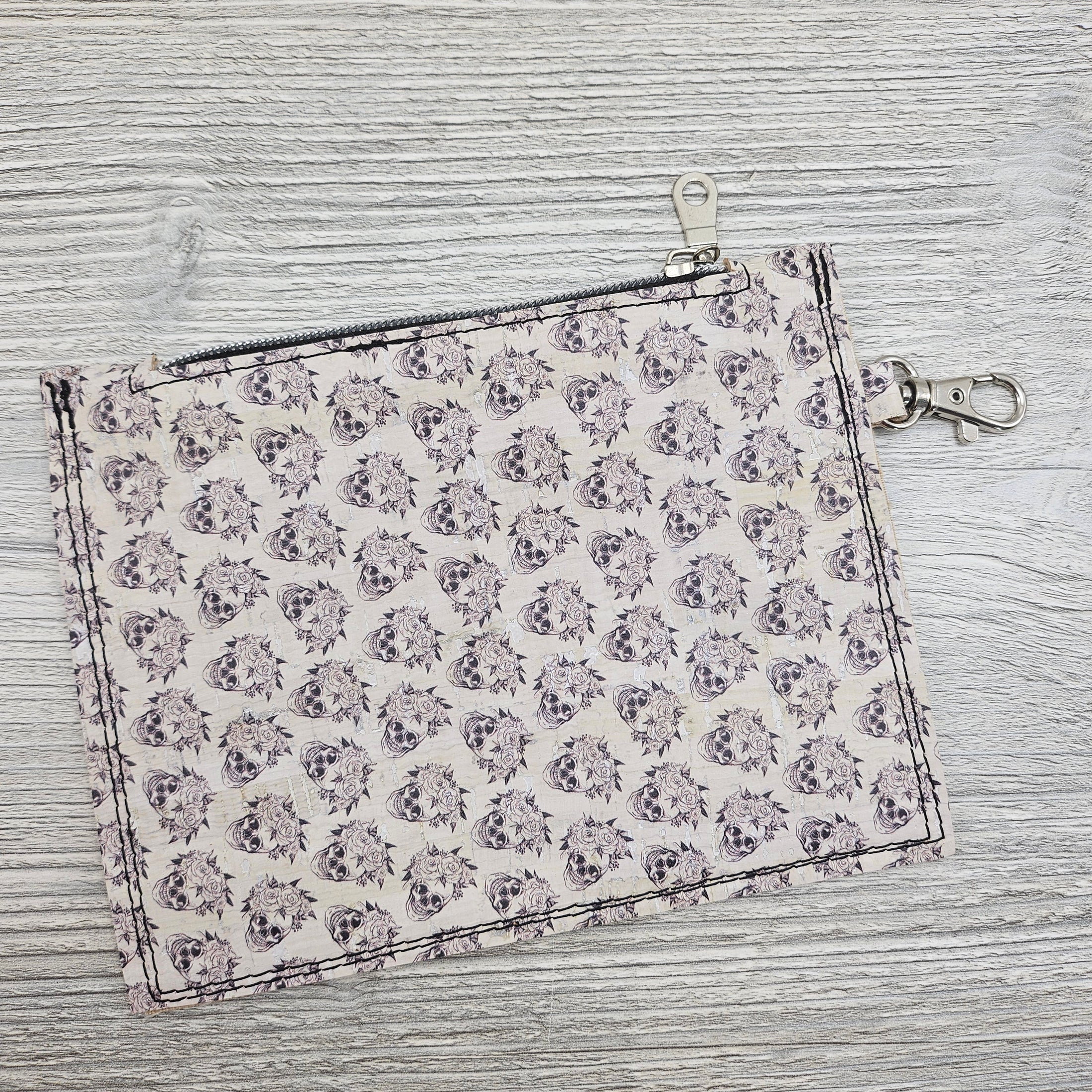 Floral skull cork bag organizer with swivel hook latch.