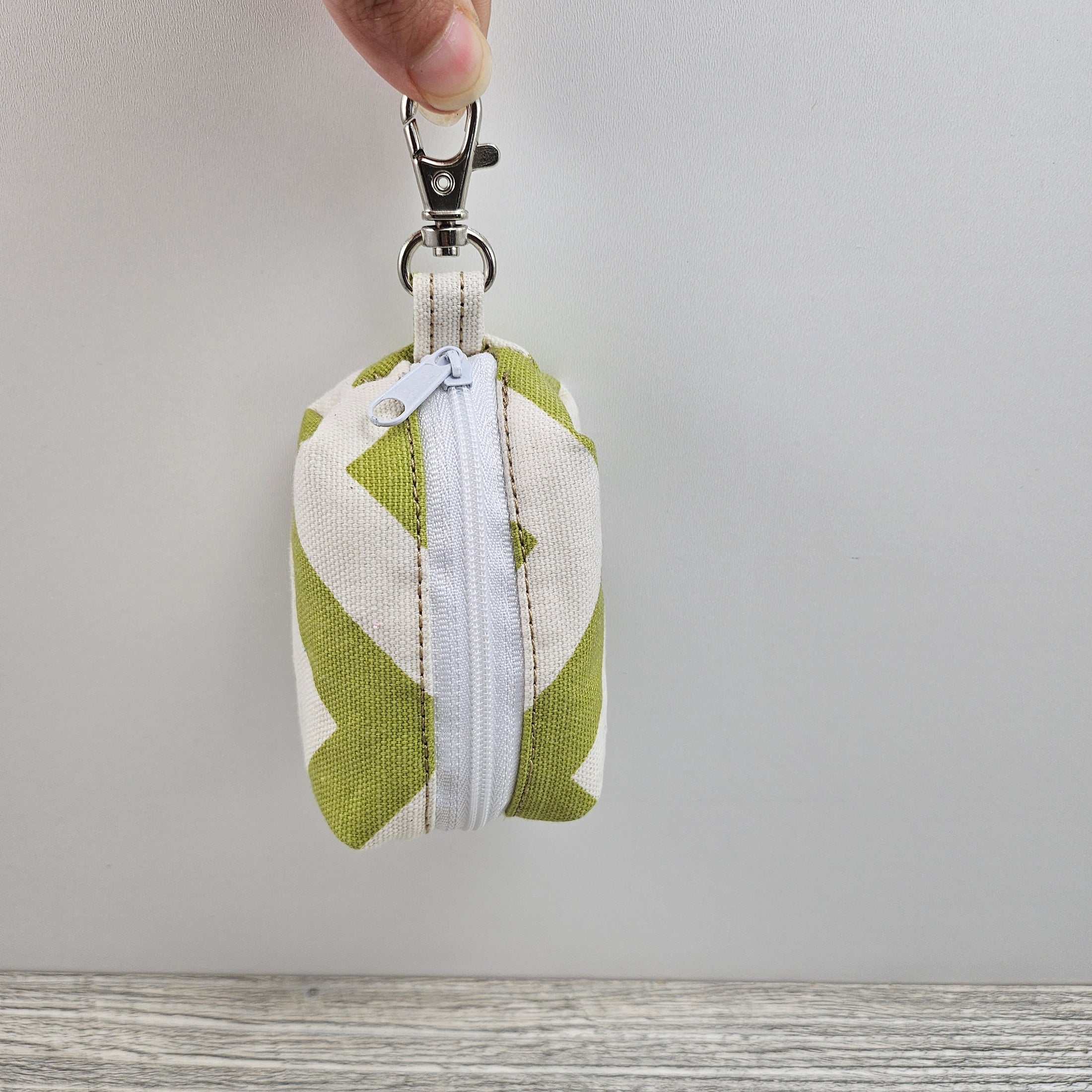 Green and cream grocery bag holder. 