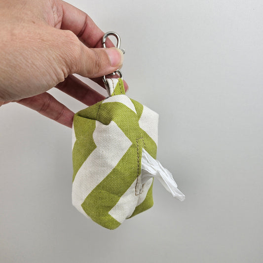 Green and cream pet bag dispenser.