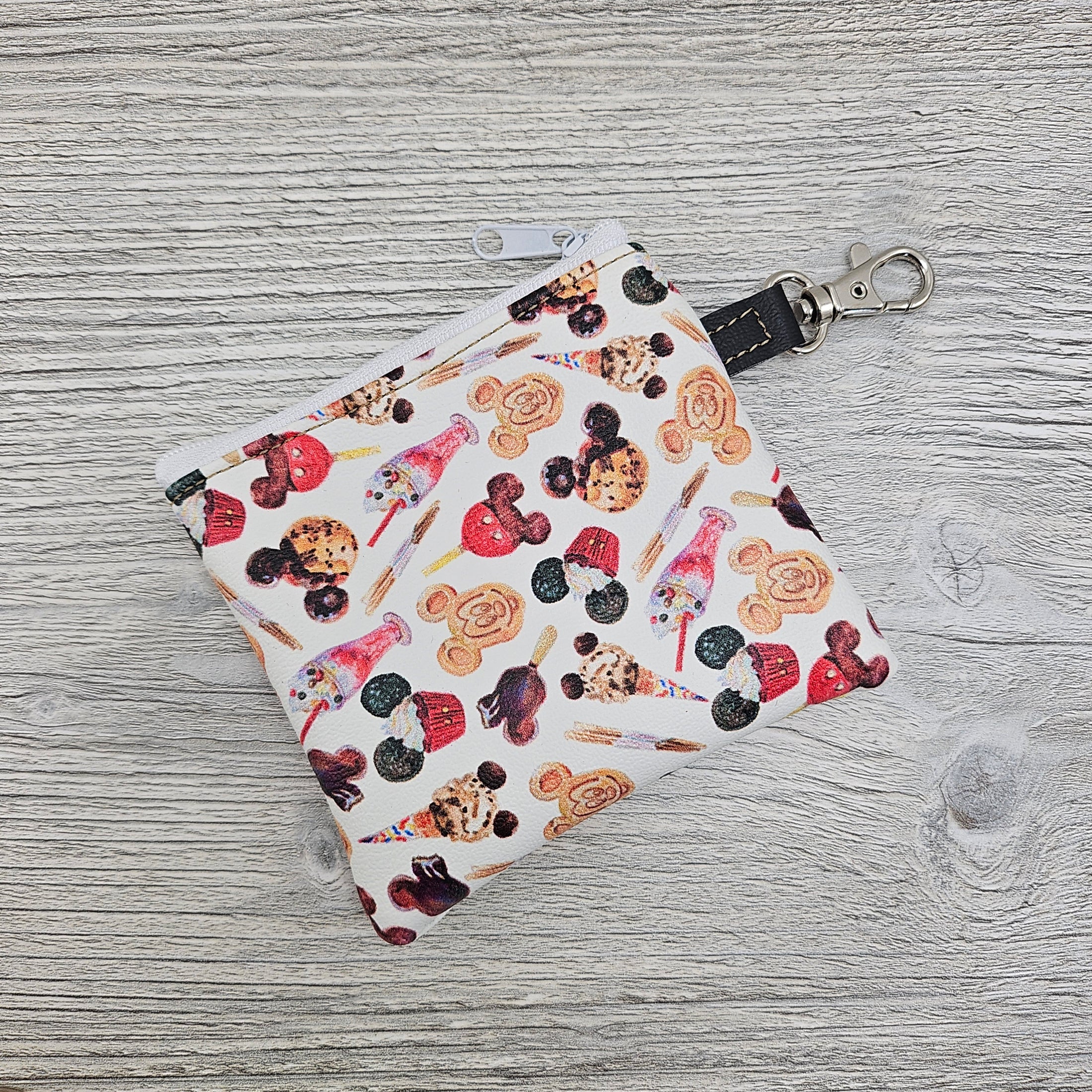 Mini disney treats zipper pouch for carrying cards and cash.