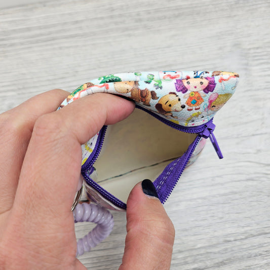 Mini vinyl zipper pouch for carrying cash, coins and cards. 