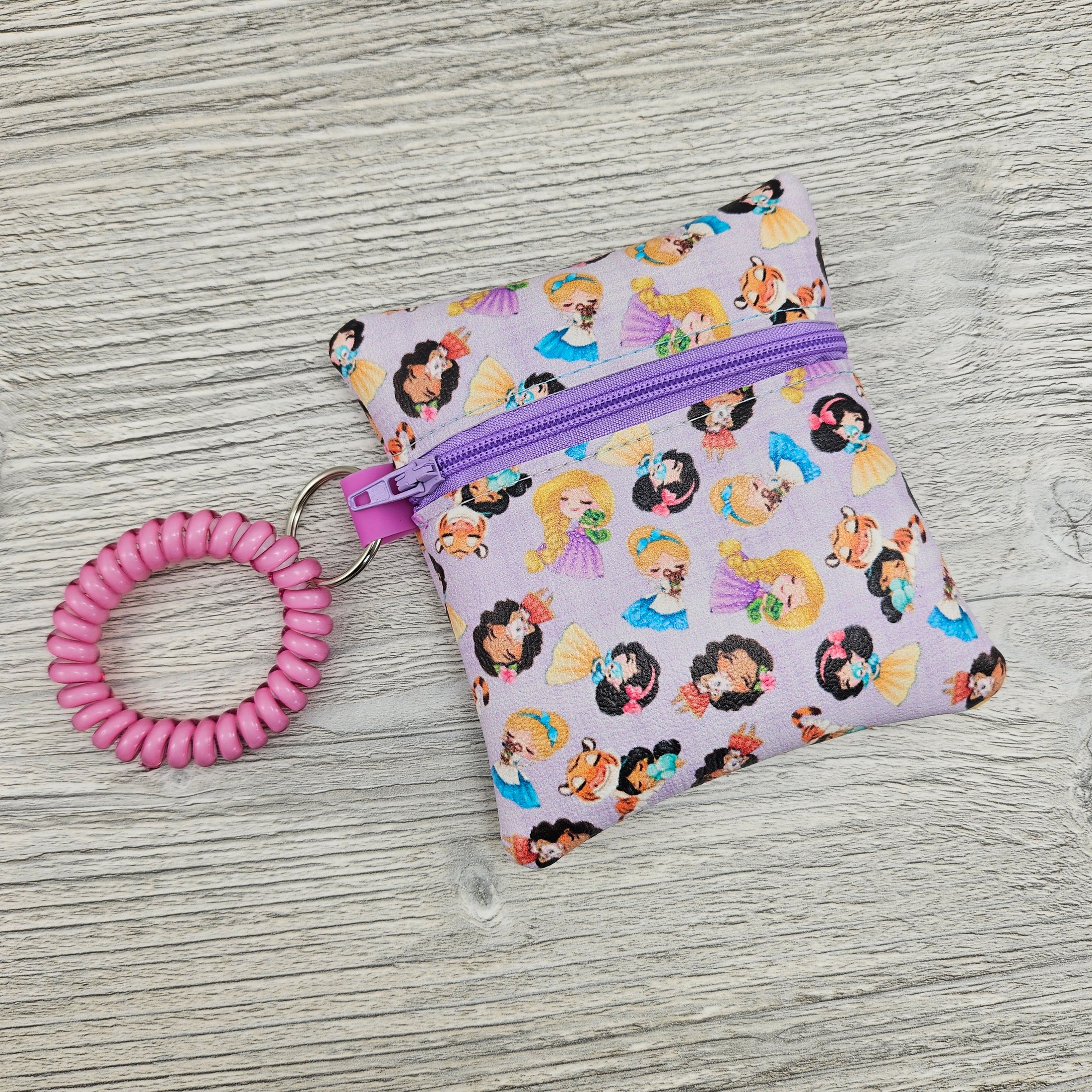 Mini disney princess inspired wristlet pouch for small accessories. 