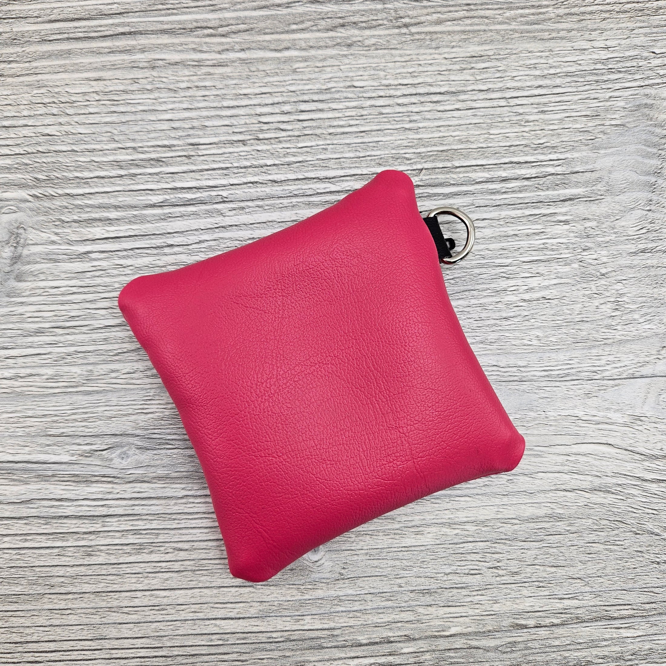 Pink mini zipper pouch for coins and cash. 