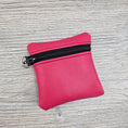 Load image into Gallery viewer, Pink mini vinyl zipper pouch with d ring to attach to key ring. 
