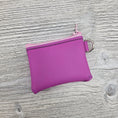 Load image into Gallery viewer, Mini pink jelly vinyl zipper pouch with d ring to attach to key ring. 
