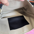 Load image into Gallery viewer, Beige and black vinyl tote bag with interior slip pocket. 
