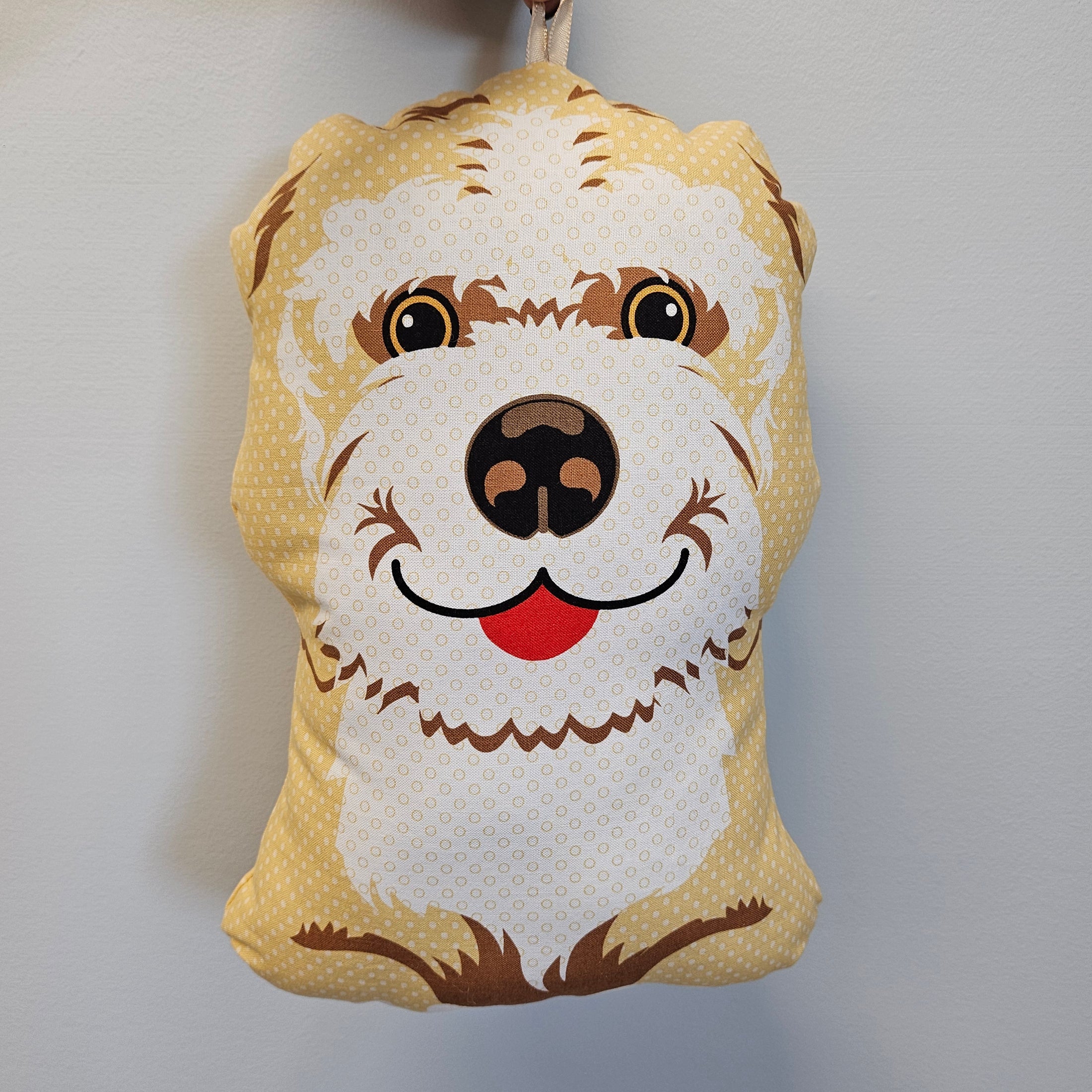 Goldendoodle snuggle pillow.