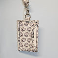 Load image into Gallery viewer, Floral skull cork id holder. 
