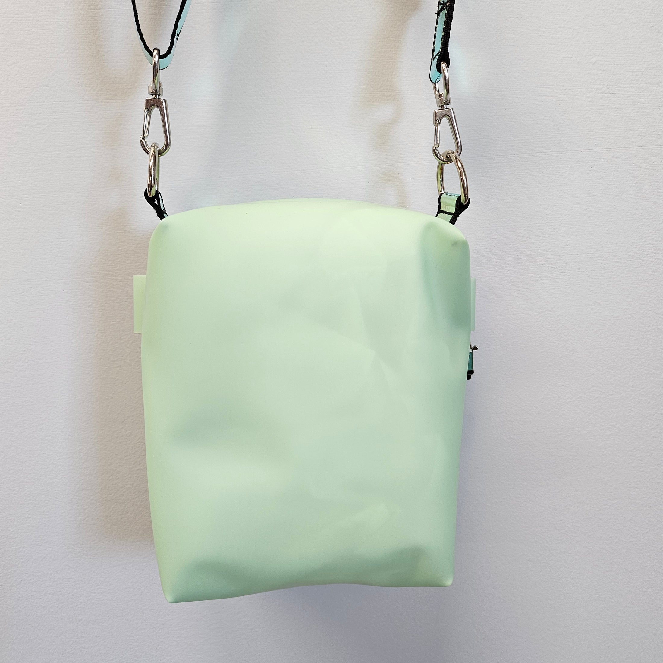 Mint green boxy crossbody bag.