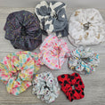 Load image into Gallery viewer, Image of all available scrunchies for sale at thesteadyhandshop.com.
