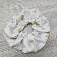 Load image into Gallery viewer, Gold bows scrunchie.
