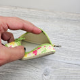 Load image into Gallery viewer, Interior of the mini spring time zipper pouch.
