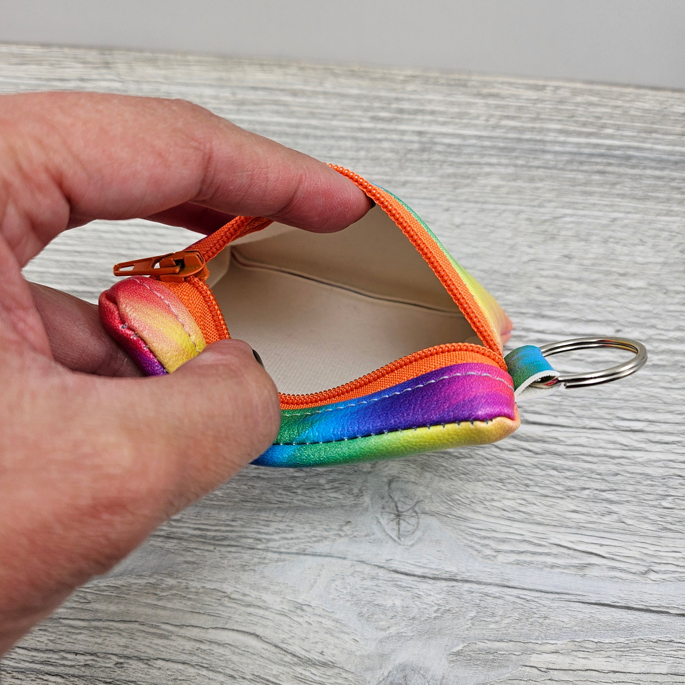 Mini rainbow zipper pouch for small items.