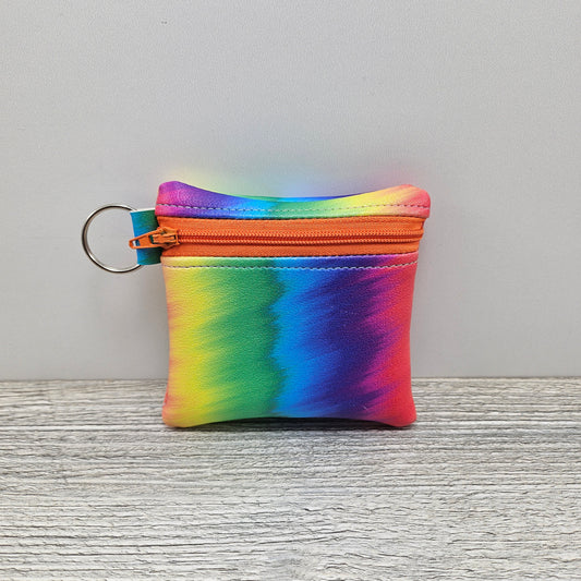 Mini rainbow zipper accessory pouch.