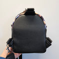 Load image into Gallery viewer, Black miley smilers mini backpack sling.
