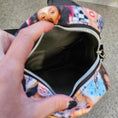 Load image into Gallery viewer, Interior of the miley smilers sling bag. 
