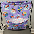 Load image into Gallery viewer, Front pocket of The Little Mermaid drawstring backpack.
