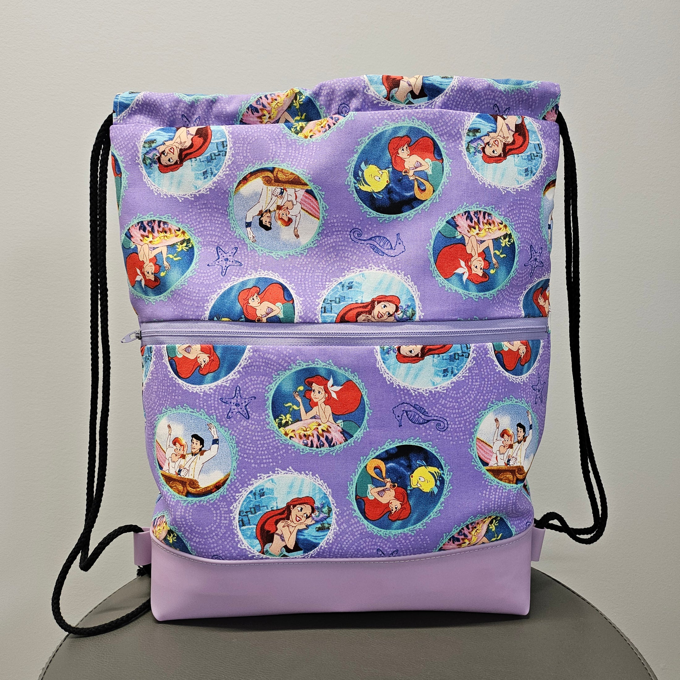Front of The Little Mermaid drawstring backpack. 