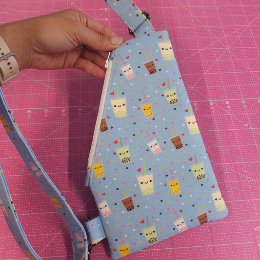 Light blue bubble tea sling bag for traveling.