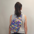 Load image into Gallery viewer, Person wearing the grogu crossbody bag on their back.
