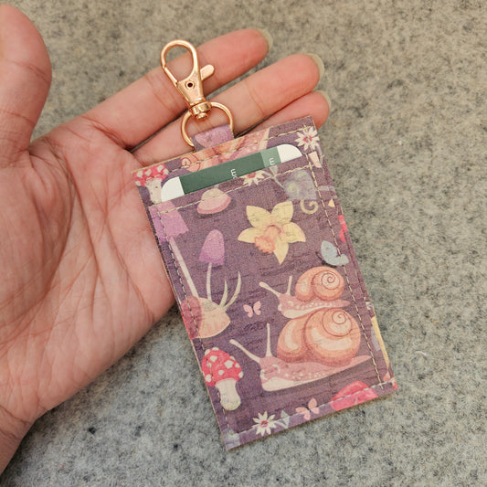Forest floor cork wallet with 3 card pockets and a lobster clasp.
