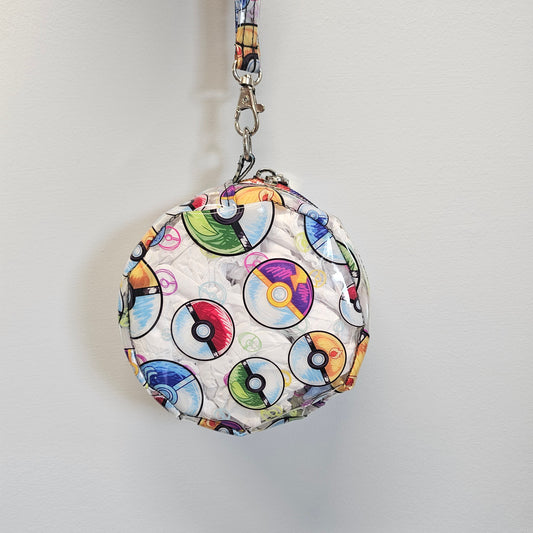Round pouch with colorful designs on a white background