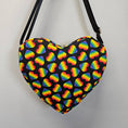 Load image into Gallery viewer, Bag with rainbow heart pattern on a black background
