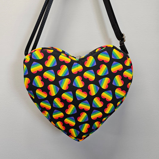 Bag with rainbow heart pattern on a black background